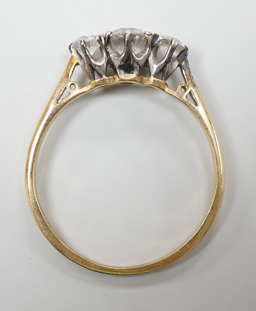 An 18ct and three stone diamond set ring, size, T/U, gross weight 2.9 grams